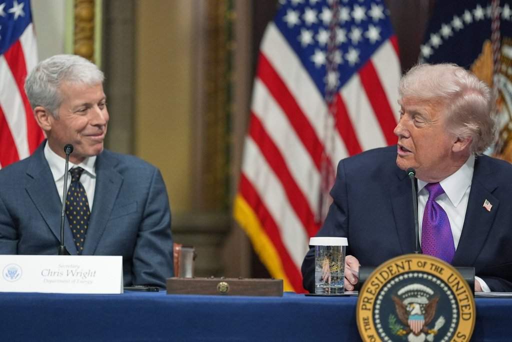 President Donald Trump looks at Energy Secretary Chris Wright as he speaks during an event about the Ratepayer Protection Pledge, in the Indian Treaty Room of the Eisenhower Executive Office Building on the White House complex, Wednesday, March 4, 2026, in Washington. (AP Photo/Jacquelyn Martin).