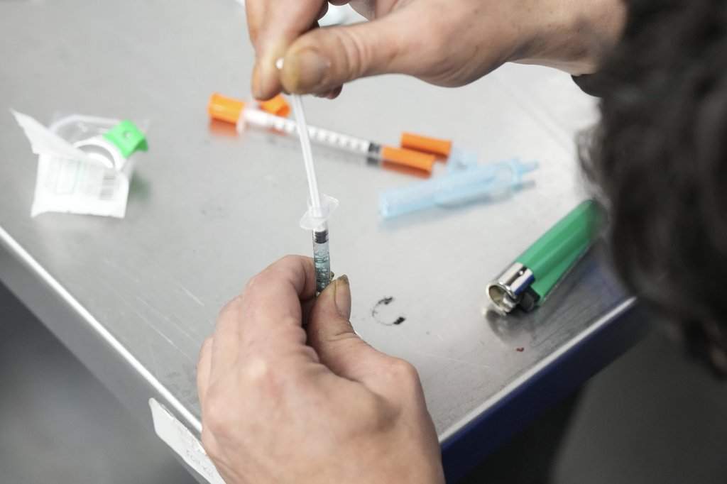 A client draws up fentanyl as he visits the consumption room at Moss Park Consumption and Treatment Service in Toronto, Tuesday, Dec. 3, 2024. 