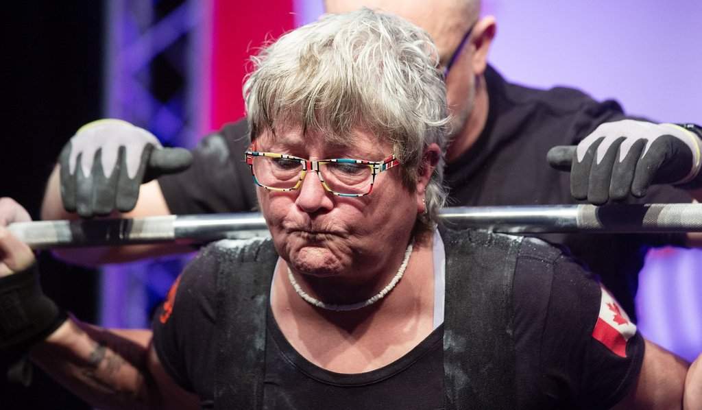 Sixty-eight-year-old Mava Brydges performs a squat lift at the Canadian Powerlifting Championships at the Sheraton Hotel in St. John's, N.L., on Thursday, March 12, 2026. THE CANADIAN PRESS/Paul Daly.