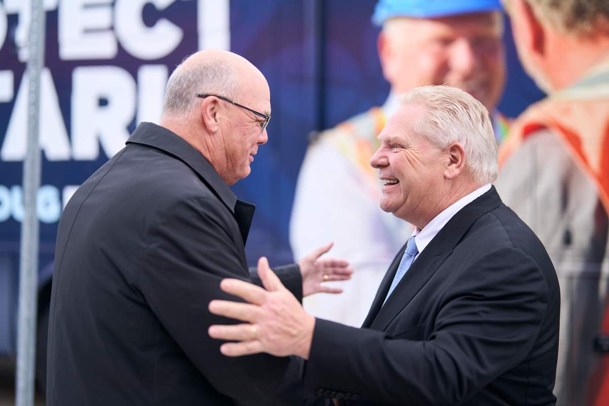 Ontario PC Leader Doug Ford, right, is greeted by Elgin- Middlesex-London MP Rob Flack during a campaign stop at Starlim North America Corporation in London, Ont. on Thursday, January 30, 2025.
