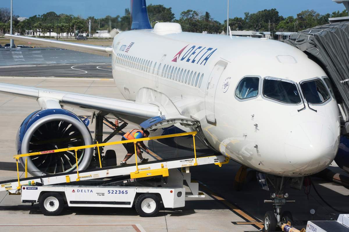 A Delta Airlines plane is serviced at Sarasota-Bradenton International airport in Sarasota, Fla., Wednesday, April 2, 2025.