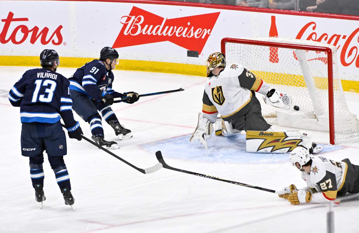 Winnipeg Jets' Cole Perfetti (91) scores on Vegas Golden Knights goaltender Adin Hill (33) during the second period of their NHL hockey game in Winnipeg, Tuesday, March 24, 2026. THE CANADIAN PRESS/Fred Greenslade.