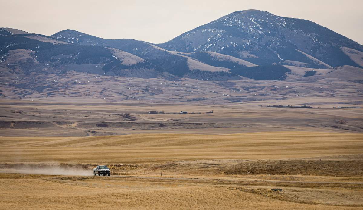 A truck passes along the United States border road near Coutts, Alta., Thursday, March 19, 2026.