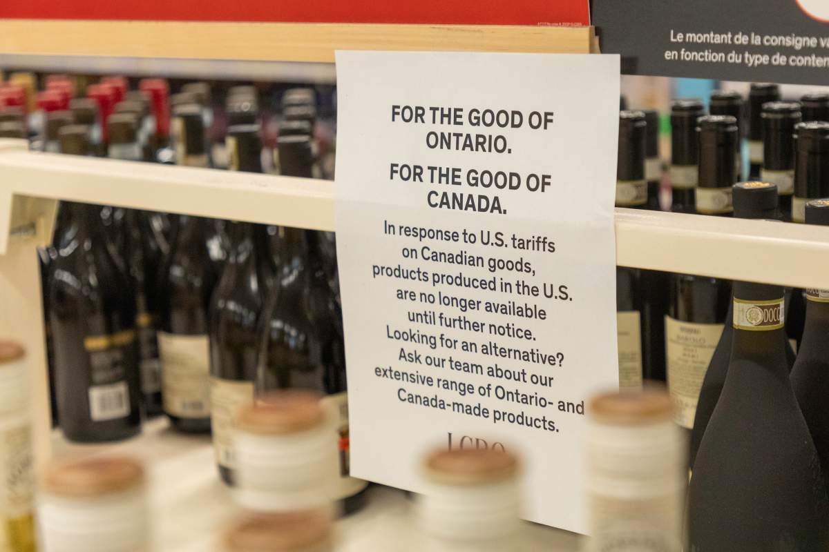 A sign referring to retaliatory measures against U.S. products is seen inside a downtown Toronto liquor store on Friday, Jan. 30, 2026. The sign states American products are no longer stocked in response to tariffs U.S. President Donald Trump imposed on Canadian goods. 