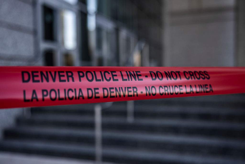 FILE: Caution tape surrounds the entrance to the Ralph L. Carr Colorado Judicial Center, home of the Colorado Supreme Court, on January 2, 2024 in Denver, Colorado.
