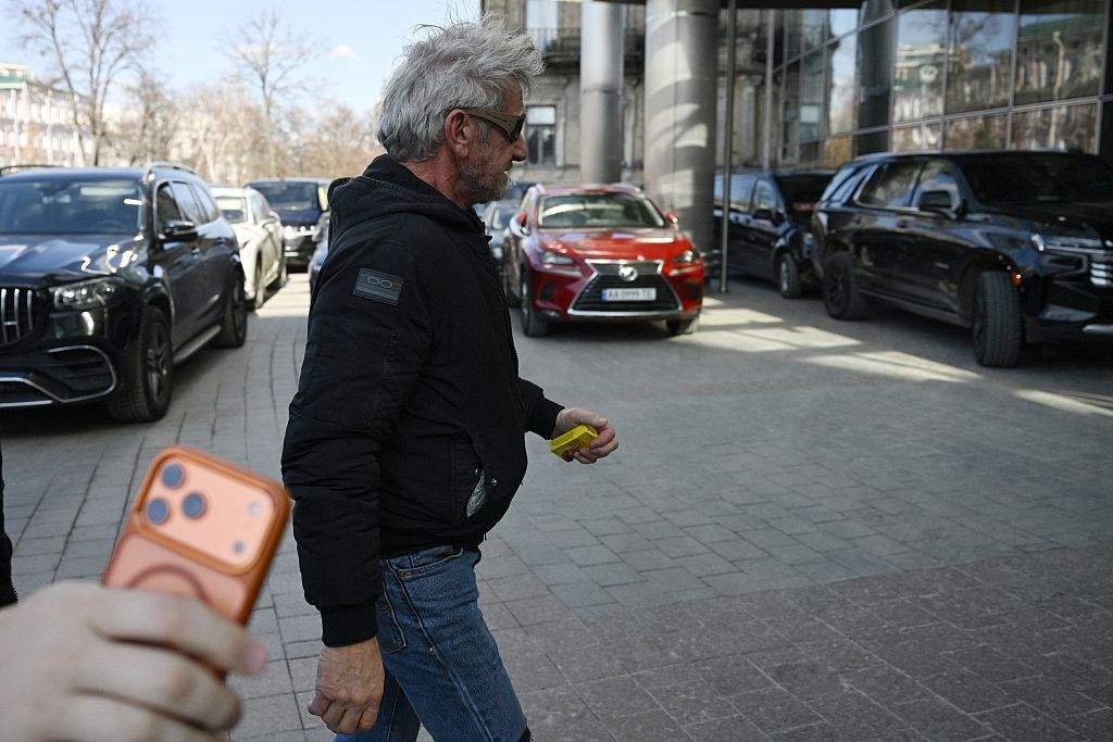 Sean Penn walks down a street in Kyiv on March 16, 2026, amid the Russian invasion of Ukraine. He is in Ukraine to show support to the war-torn country, a senior Ukrainian official told AFP. Penn -- a vocal advocate for Ukraine who had visited the country several times -- has won his third acting Oscar but was not at the ceremony.