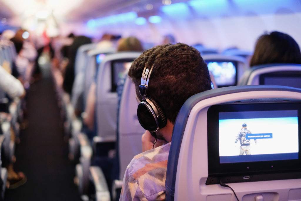 Guests participate as DJ Questlove performs during the first ever in-flight silent disco with Delta Air Lines and LSTN Sound Co. on July 18, 2017.