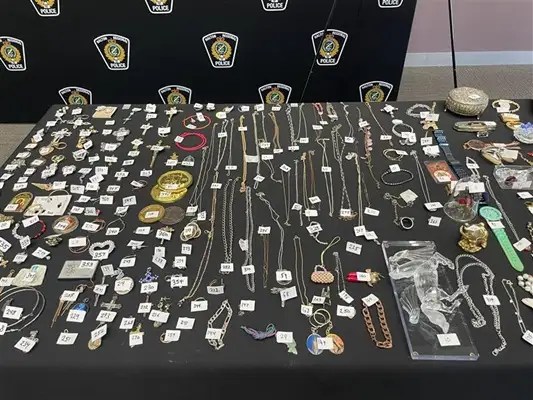 Items seized by Halton regional police stemming from a series of cemetery thefts are put on display during a news conference in Oakville, Ont., on Nov. 17, 2025.