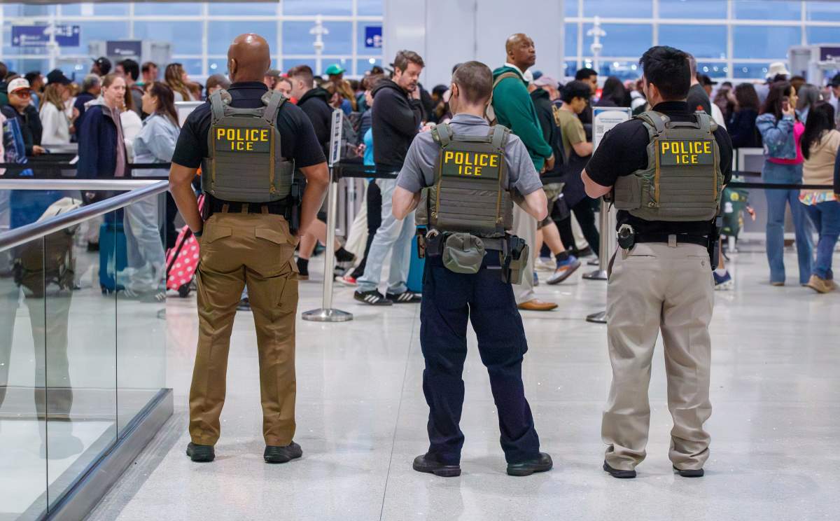U.S. Immigration and Customs Enforcement (ICE) agents patrol Louis Armstrong International Airport in Kenner, La. Monday, March 23, 2026.