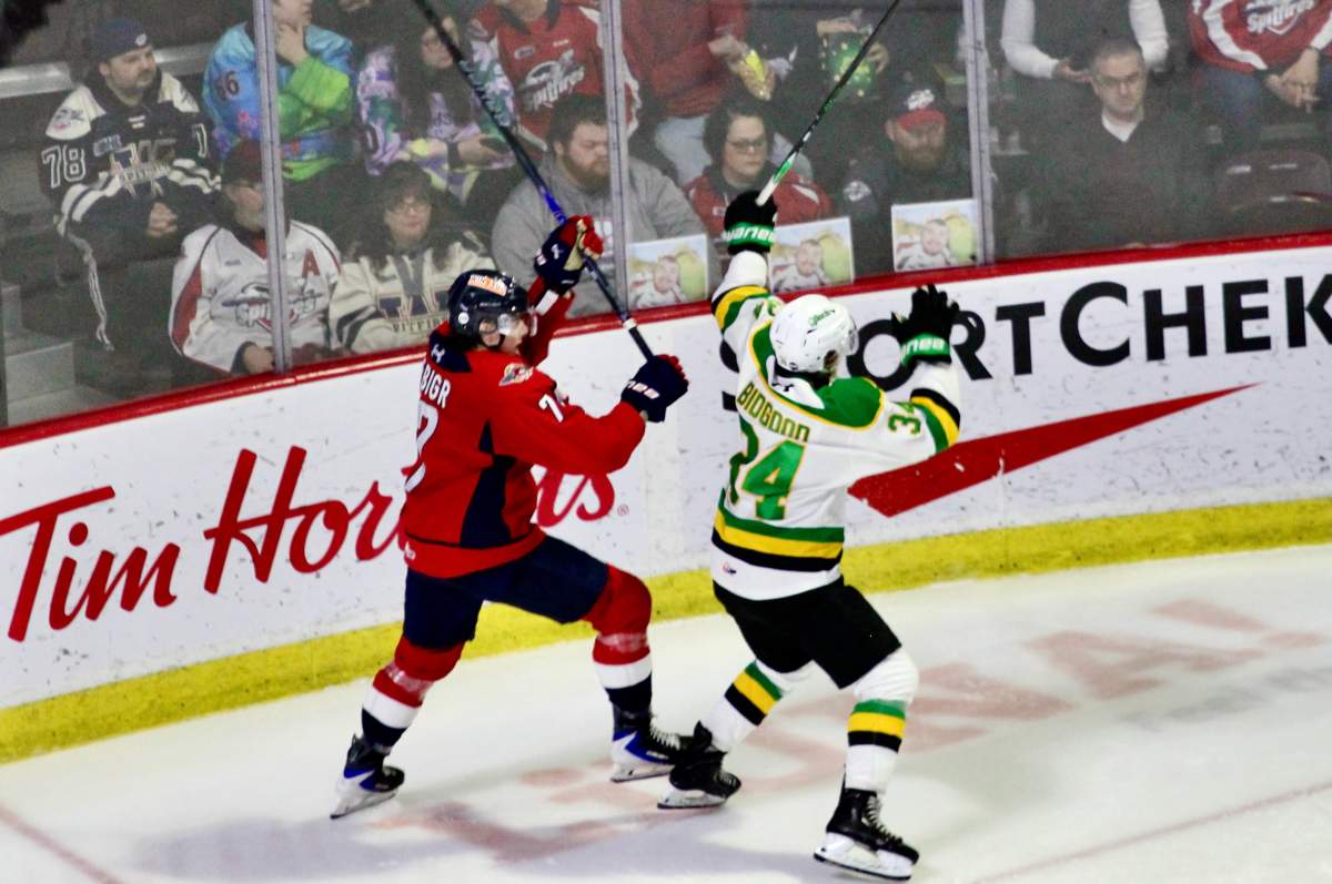 London Knights forward Cohen Bidgood collides with Windsor Spitfires defenceman Jakub Fibigr in a game played at the WFCU Centre on March 15, 2026.