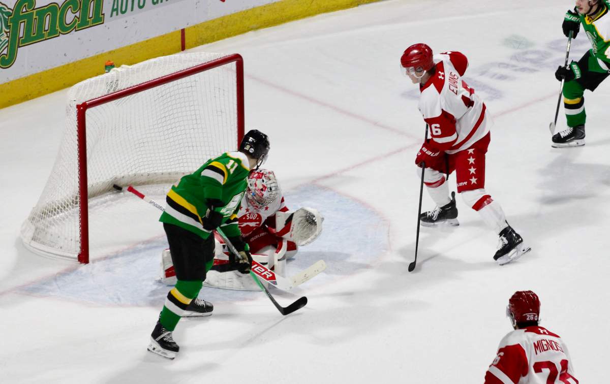 Braiden Clark of the London Knights deflects a shot past Carter George of the Soo Greyhounds in Game 2 of their first round OHL playoff series played at Canada Life Place on March 29, 2026.