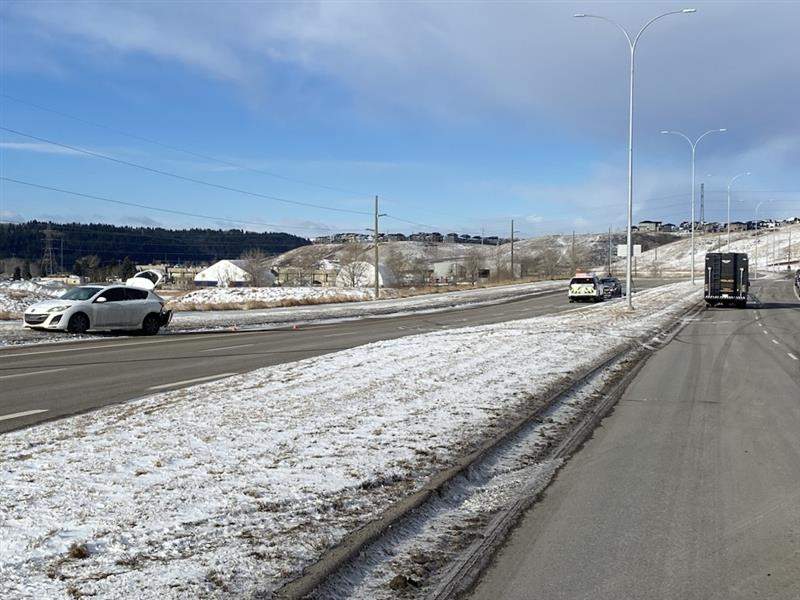 Nose Hill Drive NW was closed for most of the morning on Tuesday after a pedestrian changing a tire was hit by another vehicle. Police say the victim suffered 'life-altering' injuries.