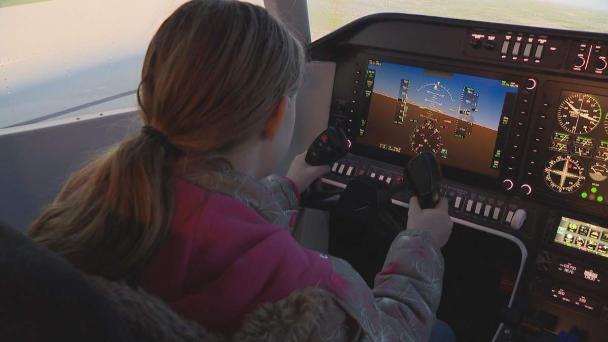 Air Cadet Claire Gaida takes a flight on the simulator at Mount Royal University's Women in Aviation Day. 