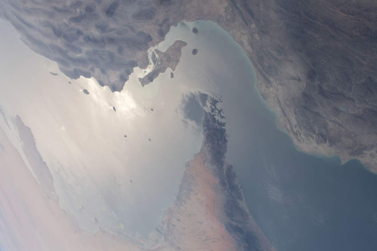 The strategically important shipping route of the Strait of Hormuz is pictured separating the nations of the United Arab Emirates and Iran. It also separates the main water bodies of the Persian Gulf and the Gulf of Oman.