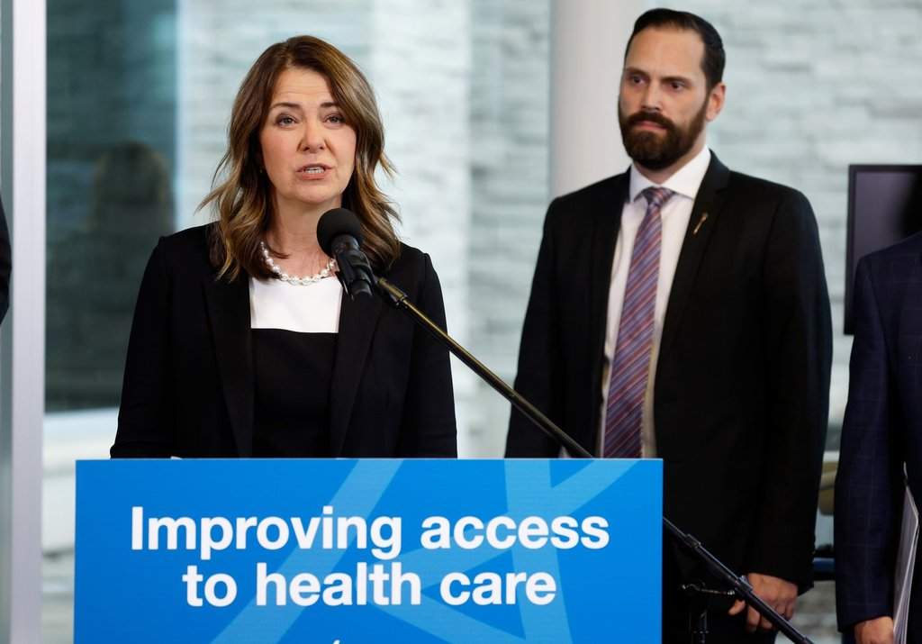 Alberta Premier Danielle Smith, left, and Matt Jones, minister of hospitals, make a health-care announcement in Calgary on Friday, Nov. 14, 2025.