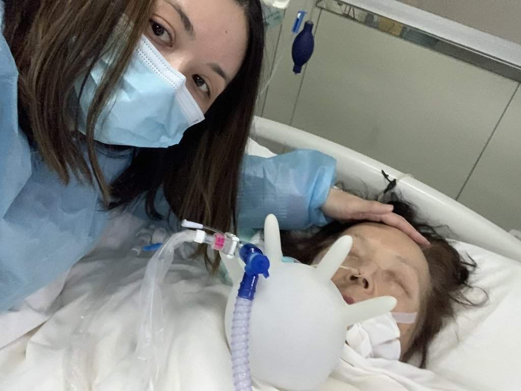 Elena Lanteigne, left, poses for a photo with her mother, Lilia Avoutova, 78, who is in a coma at a hospital in Kunming, China in this undated handout photo. 