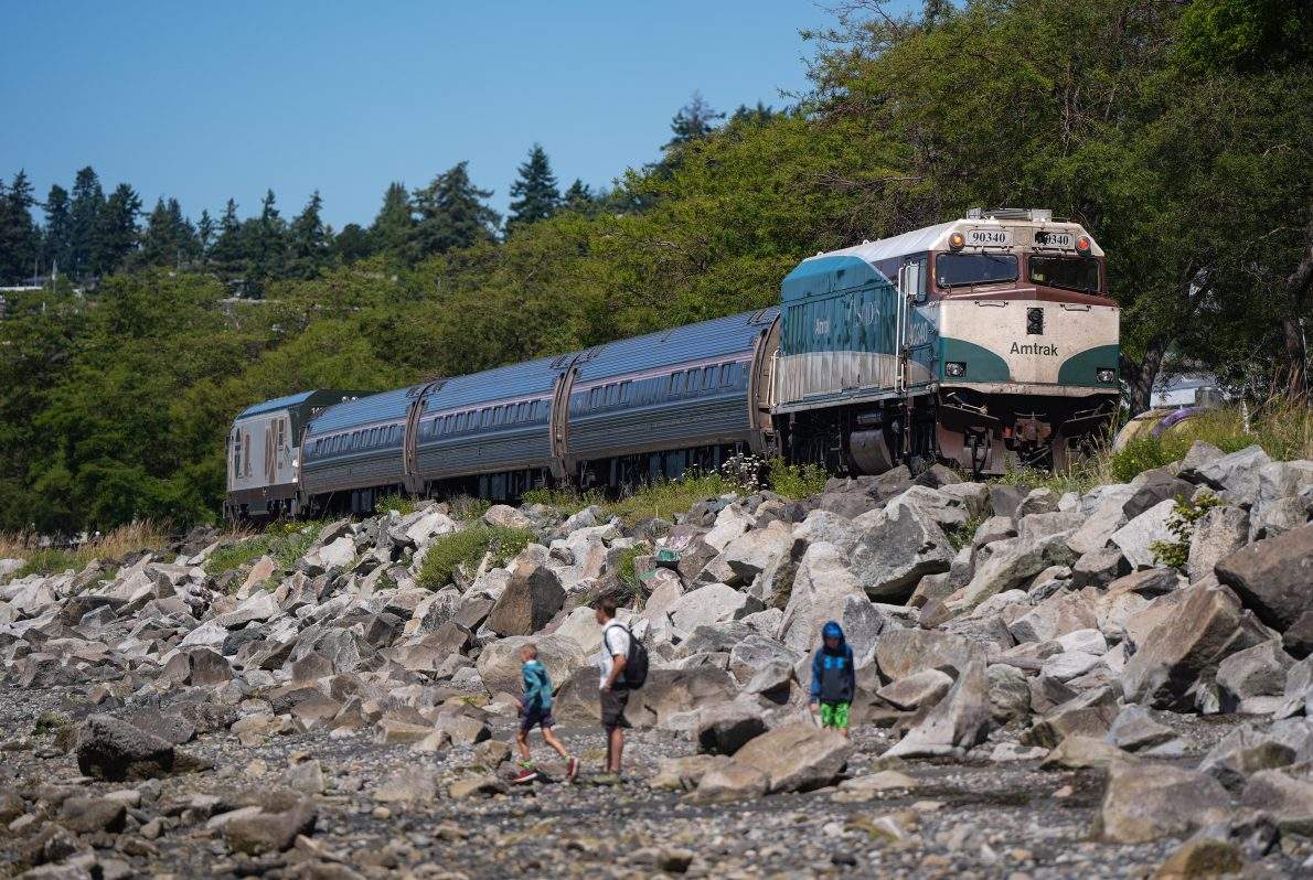 FILE - The Amtrak Cascades train passes through White Rock, B.C., while en route to Vancouver, on Monday, July 28, 2025.