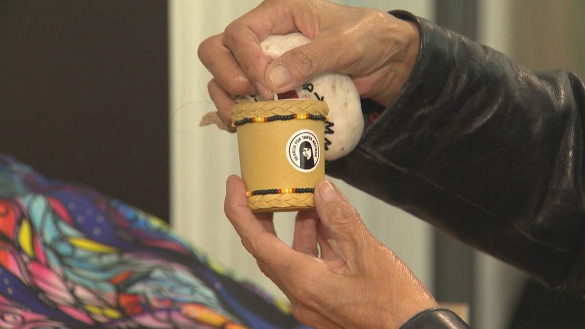 A candle with Tanya Nepinak’s image on it. Her aunt says it represents Nepinak lighting her way home.