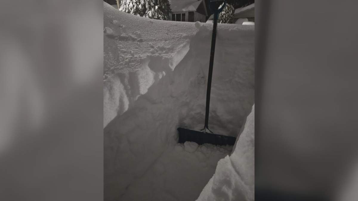 A shovel sits in a hollowed-out portion of snow that fell in Capreol, Ont., on March 15.
