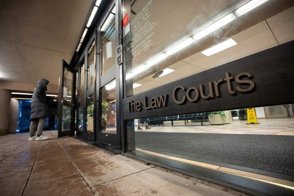 A person enters The Law Courts building, which is home to B.C. Supreme Court and the Court of Appeal, in Vancouver, on Monday, January 12, 2026. THE CANADIAN PRESS/Ethan Cairns.