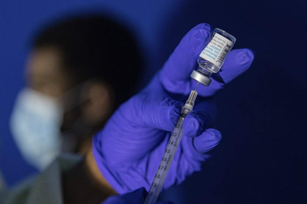 FILE - Family nurse practitioner Carol Ramsubhag-Carela prepares a syringe with the Mpox vaccine before inoculating a patient at a vaccinations site on Tuesday, Aug. 30, 2022. 