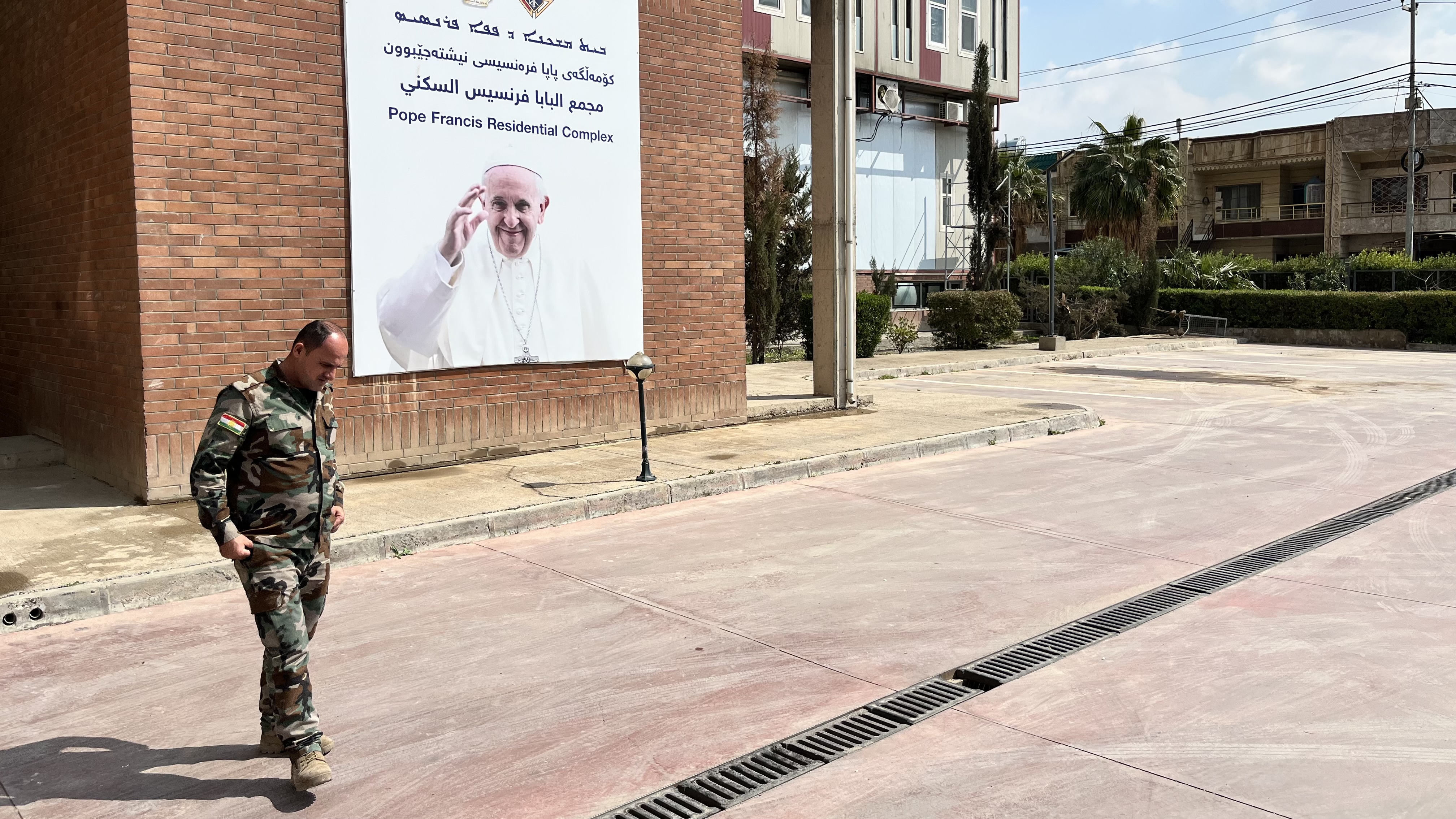 Security guard outside church hit by drone, Erbil, Iraq, March 9, 2026.