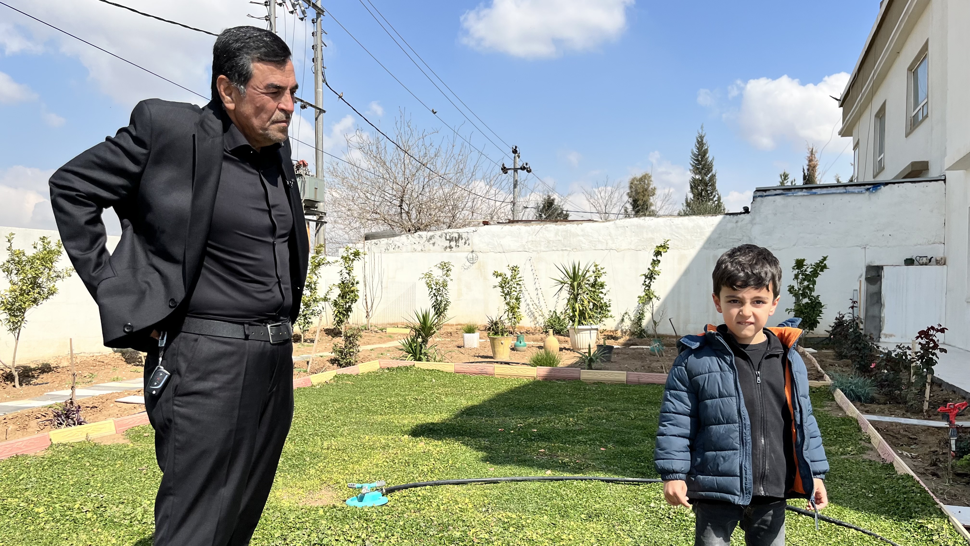 The father and son of Walat Tahir, killed in a drone strike in Erbil, Iraq, March 9, 2026.