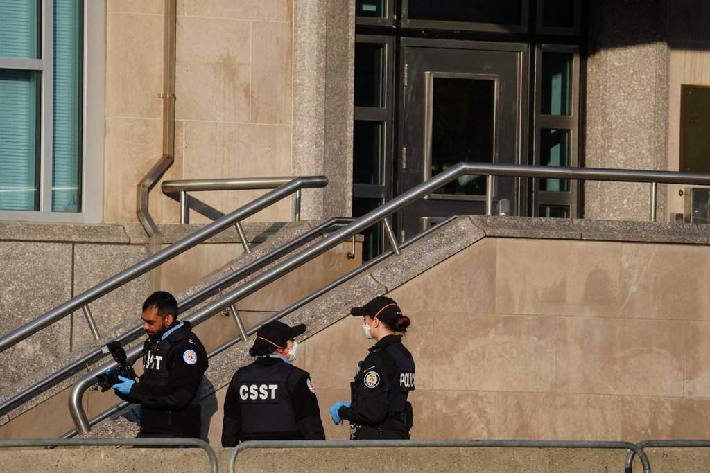 Forensic Toronto police officers looks for evidence at the U.S. consulate in Toronto on Tuesday March 10, 2026. Police are investigating reports that the United States consulate in Toronto’s downtown core was hit by early morning gunfire Tuesday.