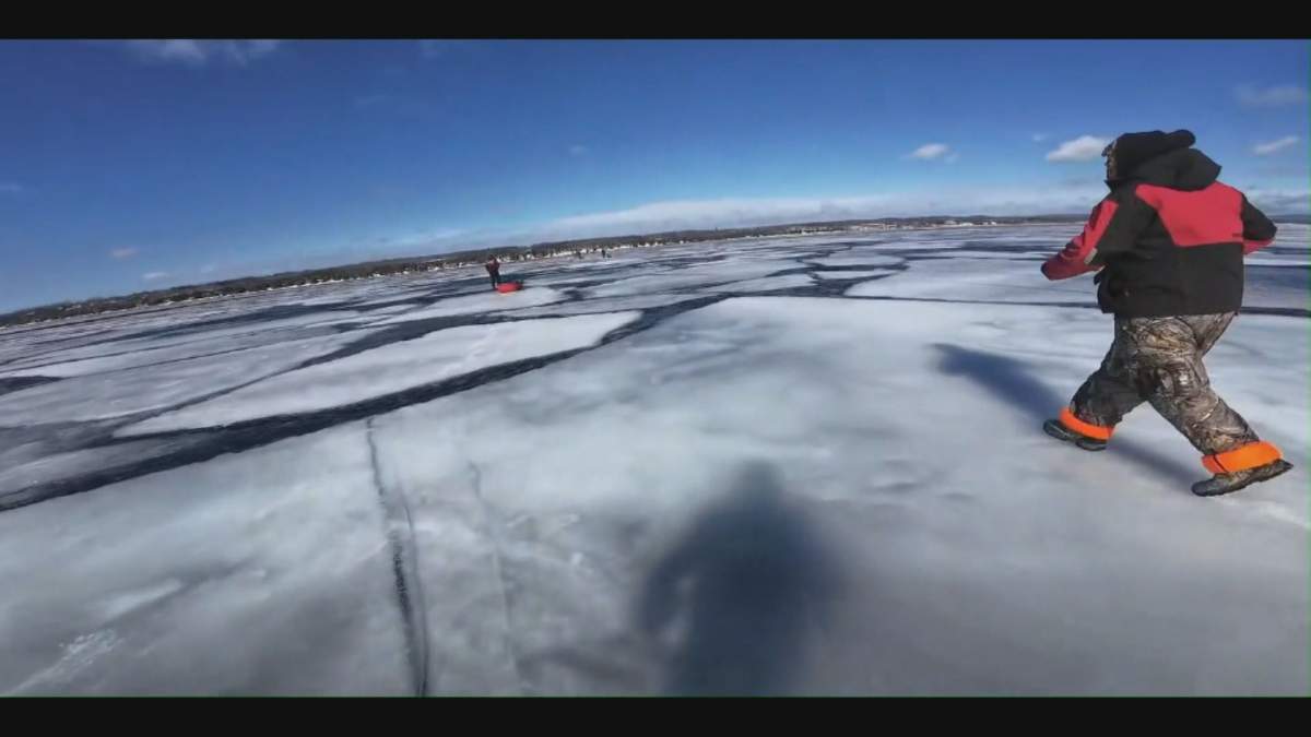 Kevin Fox, not pictured, and other fishermen run across an ice shelf as it breaks off the Georgian Bay shore on Sunday, March 8, 2026.