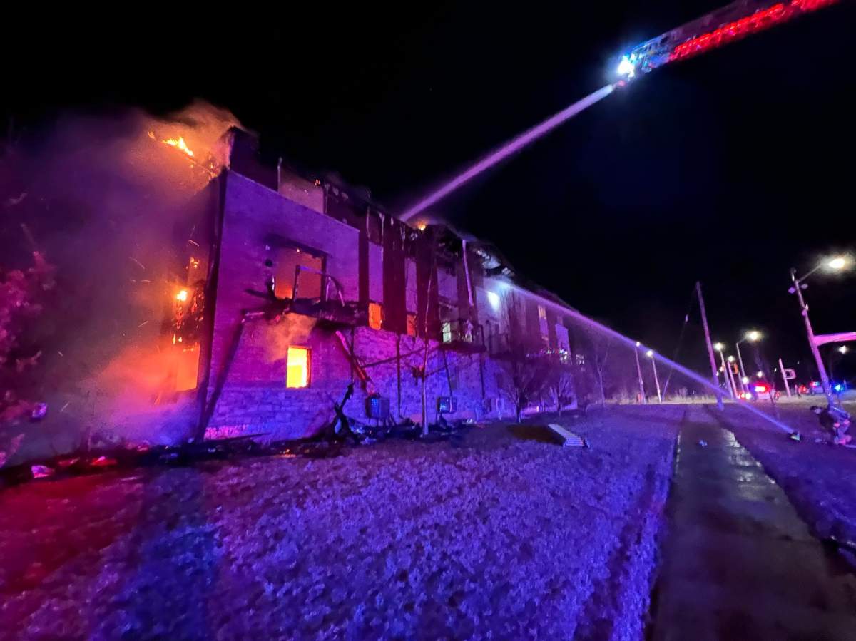 Hamilton fire crews work to put out a fire at a multi-unit residential complex on March 9 in Stoney Creek, Ont.