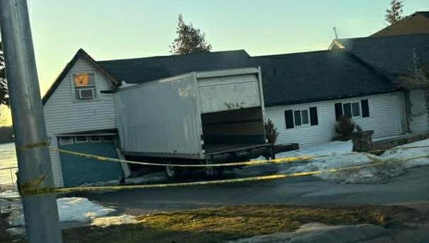 A cube van crashed into a Bath Road garage late Saturday, leading to a dramatic scene Sunday where a frustrated motorist struck a police officer with their car.
