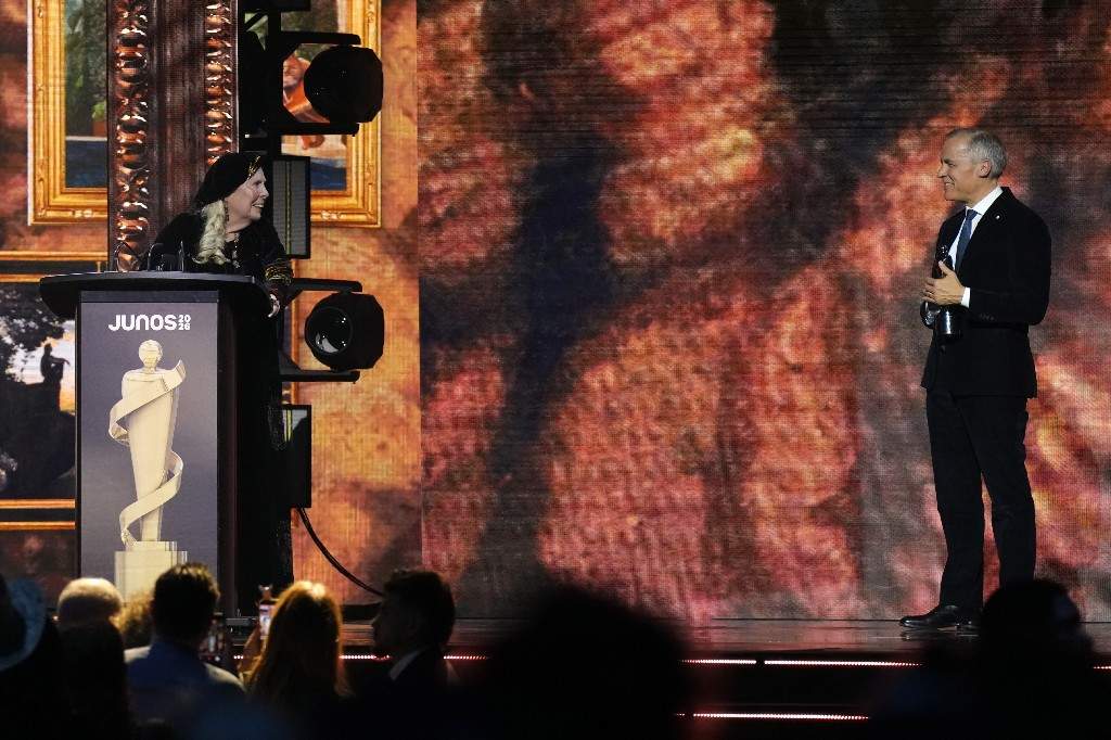 Prime Minister Mark Carney presents the Lifetime Achievement award to Joni Mitchell at the 2026 Juno Awards in Hamilton, on Sunday, March 29, 2026.