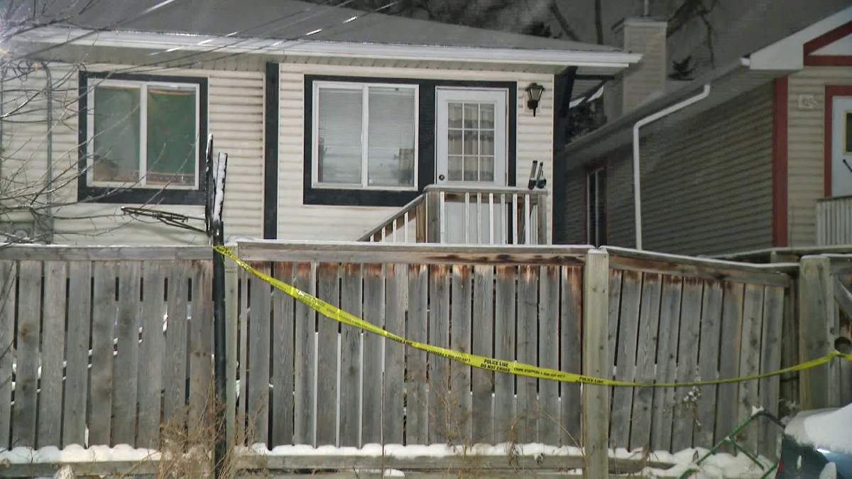 Police tape surrounds a house in the southeast Calgary community of Crestwood Wednesday evening after a person was taken to hospital in life-threatening condition following an "altercation."