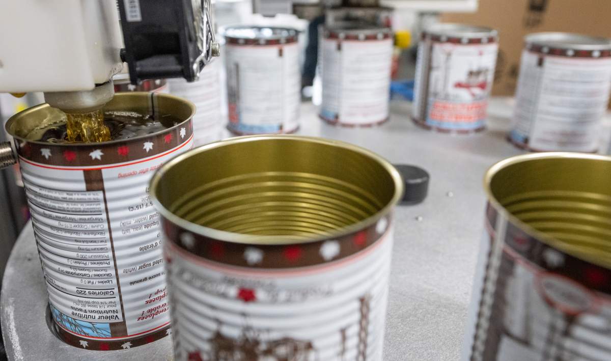 Maple syrup is canned at Erabliere Cote et Fils in Roxton Pond, Que., on Monday, March 9, 2026. 