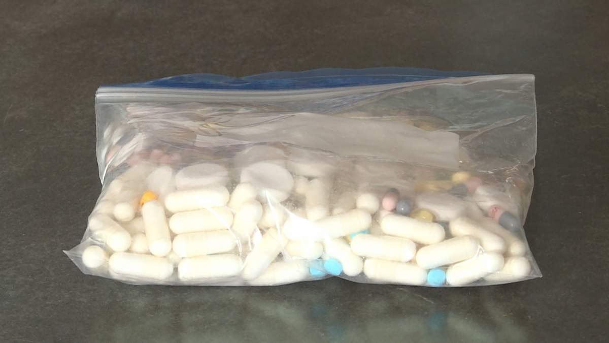 Calgarian Krisit Keller shows off the cocktail of vitamins and drugs she uses for the treatment and prevention of her migraine headaches.