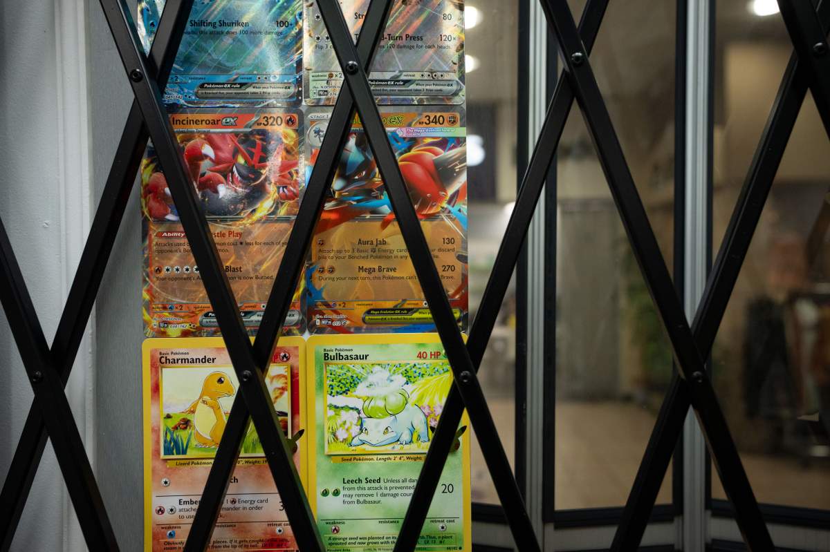 Promotional Pokemon cards are pictured behind a security gate at Team Collectors store in Richmond B.C., on Monday, March 9, 2026.
