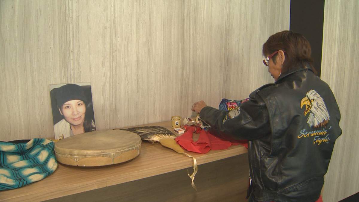 Sue Caribou lays out items that she says help her stay strong in her journey to bring her niece, Tanya Nepinak, home.