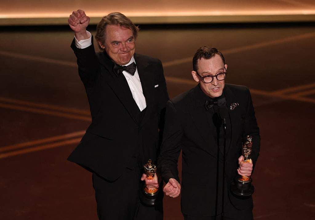 Maciek Szczerbowski (L) and Canadian animator Chris Lavis speak onstage after winning the Oscar for Best Animated Short Film for "The Girl Who Cried Pearls" during the 98th Annual Academy Awards at the Dolby Theatre in Hollywood, California on March 15, 2026.