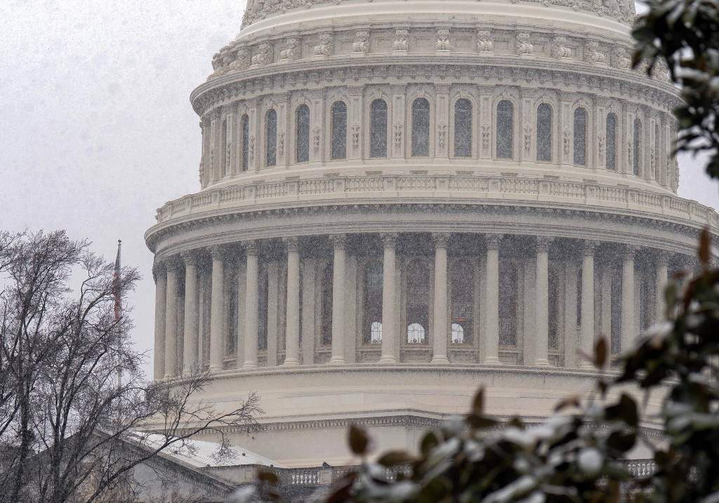 The U.S. Capitol is seen during a snowy day on Capitol Hill Thursday, March 12, 2026, in Washington.