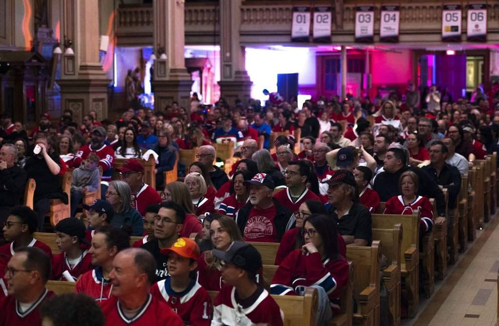 Fans watch the Montreal Canadiens play the Tampa Bay Lightning during NHL playoff hockey action in the Cathedral of Saint-Jean-l’Evangeliste in Saint-Jean-sur-Richelieu, Que., on Friday, April 24, 2026.