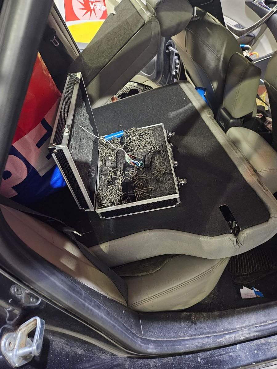 A briefcast improvised explosive device containing screws, found in a car during a traffic stop in Sherwood Park, Alta. on April 7, 2026.