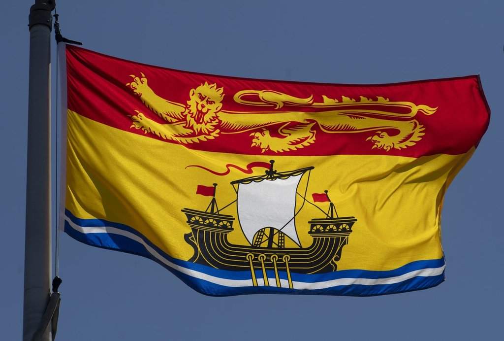 New Brunswick's provincial flag flies on a flagpole in Ottawa, on Monday, July 6, 2020. THE CANADIAN PRESS/Adrian Wyld.