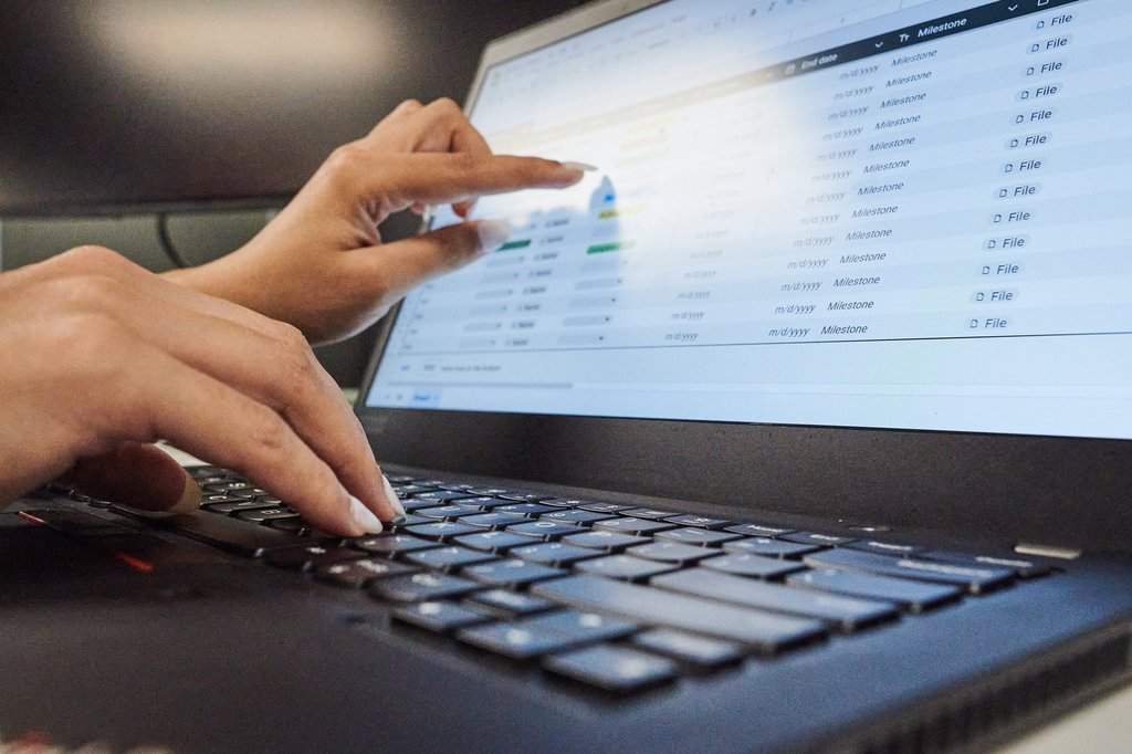 A person works on a spreadsheet in a photo illustration made in Toronto on Monday, Sept. 22, 2025. THE CANADIAN PRESS/Sammy Kogan.