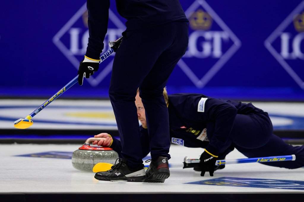 Sweden's Niklas Edin delivers the rock during a gold medal match against Canada at the curling world championships, Saturday, April 4, 2026, in Ogden, Utah. (AP Photo/Tyler Tate).