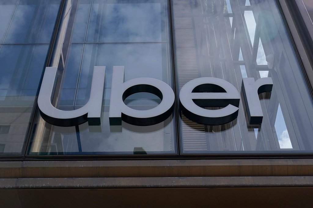 FILE - An Uber sign is displayed at the company's headquarters in San Francisco, Monday, Sept. 12, 2022.