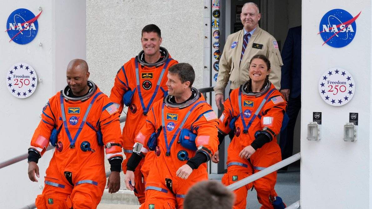 Astronauts, from left, pilot Victor Glover, Canadian Space Agency astronaut Jeremy Hansen, commander Reid Wiseman and mission specialist, Christina Koch leave the Operations and Checkout building on their way to Launch Pad 39B for a planned liftoff on NASA’s Artemis II moon rocket at the Kennedy Space Center, Wednesday, April 1, 2026, in Cape Canaveral, Fla. (AP Photo/John Raoux)