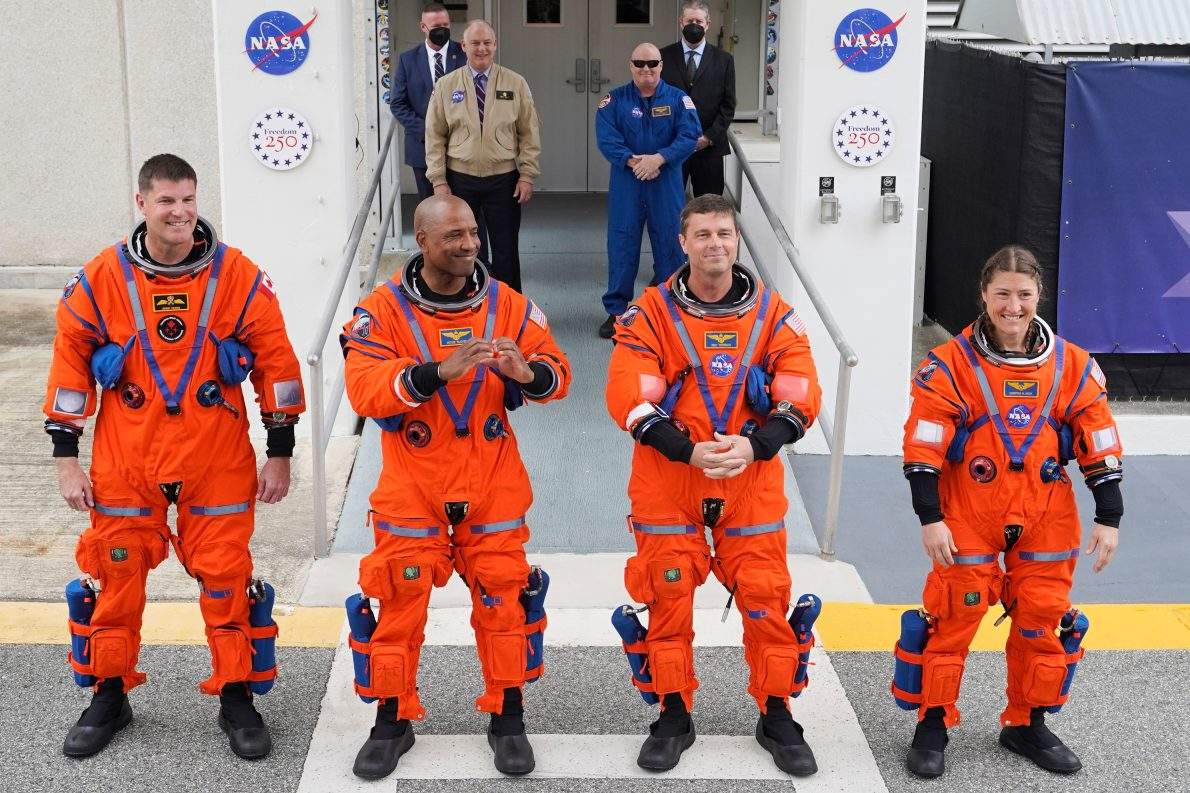Astronauts, from left, Canadian Space Agency astronaut Jeremy Hansen, pilot Victor Glover, commander Reid Wiseman and mission specialist, Christina Koch leave the Operations and Checkout building on their way to Launch Pad 39B for a planned liftoff on NASA’s Artemis II moon rocket at the Kennedy Space Center, Wednesday, April 1, 2026, in Cape Canaveral, Fla. (AP Photo/John Raoux)