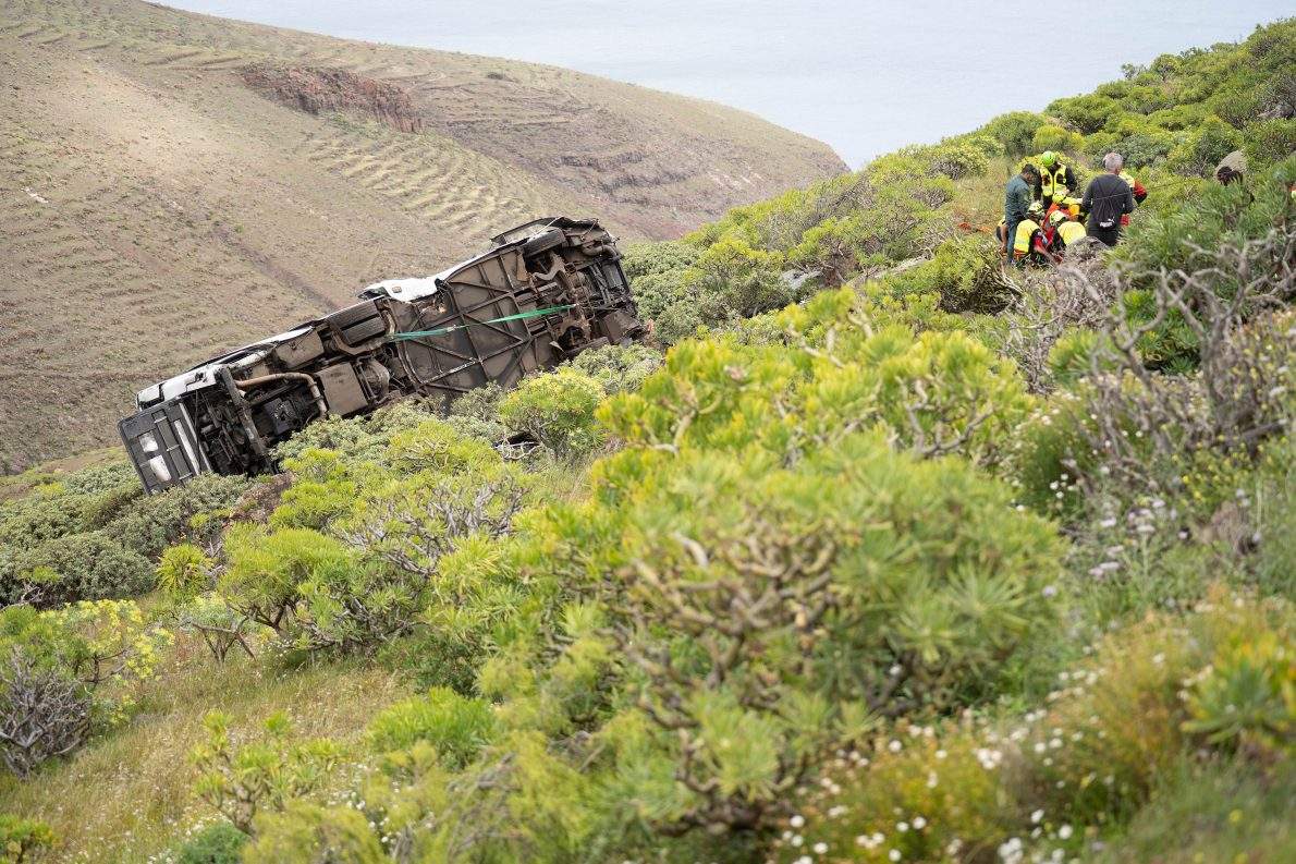Rescuers work at the scene of a bus crash near in San Sebastian de La Gomera, in Spain's Canary Islands, Friday, April 10, 2026. (Europa Press Canarias/Europa Press via AP).