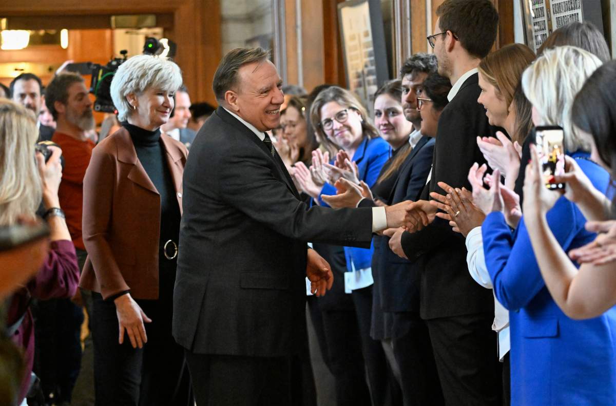 Quebec Premier Francois Legault shakes hands while staff members line up after his farewell speech at the legislature in Quebec City, Thursday, April 2, 2026.