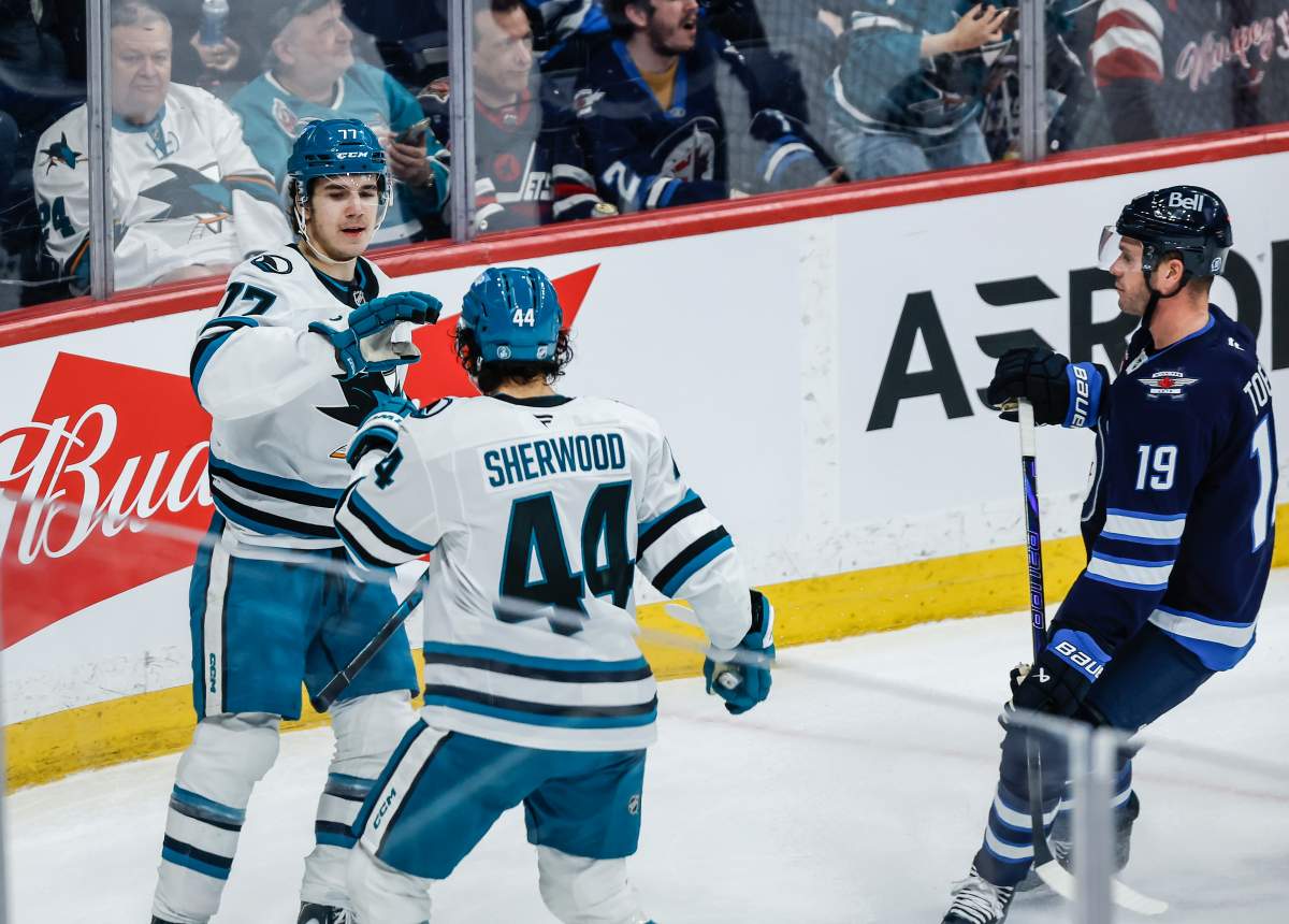 San Jose Sharks' Michael Misa (77) and Kiefer Sherwood (44) celebrates Misa's goal against the Winnipeg Jets during second period NHL action in Winnipeg, Thursday, April 16, 2026. THE CANADIAN PRESS/John Woods.